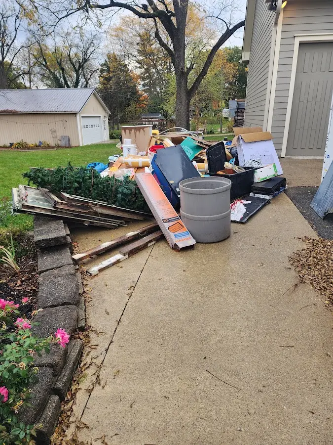 Dumpster being loaded with debris for Residential Dumpster Rental in Wauseon
